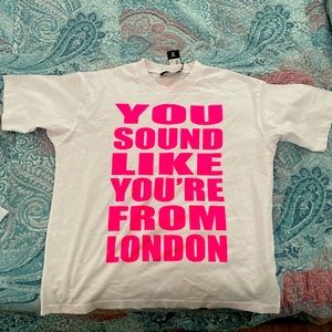 White & pink tee. Size M could fit large . No need for it anymore